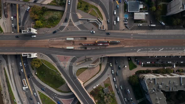 Aerial Birds Eye Overhead Top Down View of Traffic on Road Intersection on Riverbank