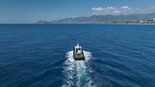 Tug Boat Sails in Port Aerial View 4 K Turkey Alanya