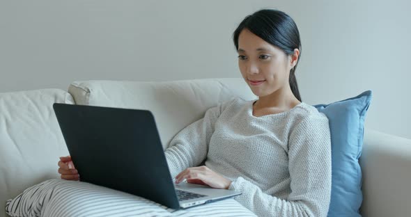 Woman use of laptop computer at home