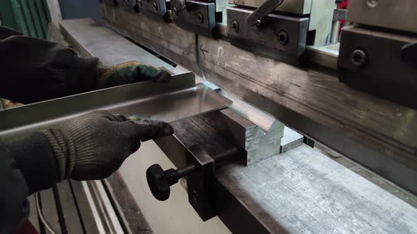 Bending a Thick Sheet of Metal on a Bending Machine Closeup