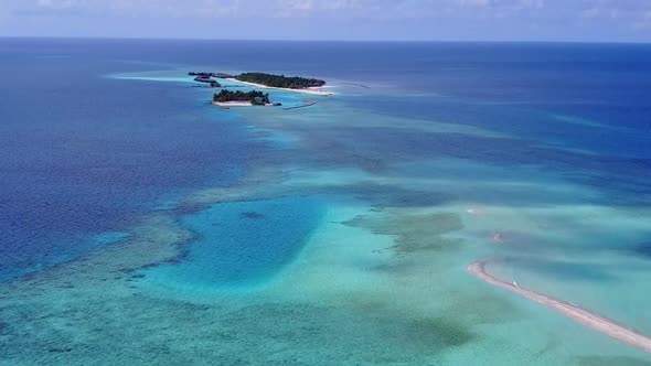 Aerial drone seascape of shore beach by lagoon and sand background