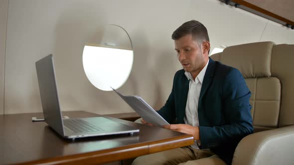 Young Entrepreneur Sleeping Inside of Private Jet Cabin
