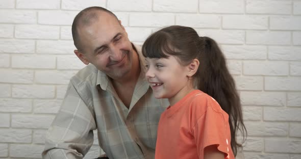 Playful Child with Father in the Room