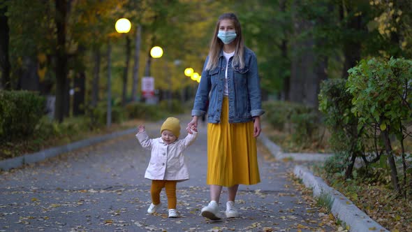 Masked Mother Holds Hand Lovely Daughter on Street Walk During Second Wave Quarantine Coronavirus