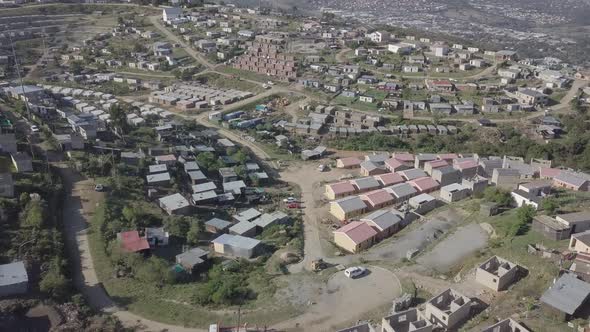 Aerial: New home construction in Xolweni Township above Knysna, Africa