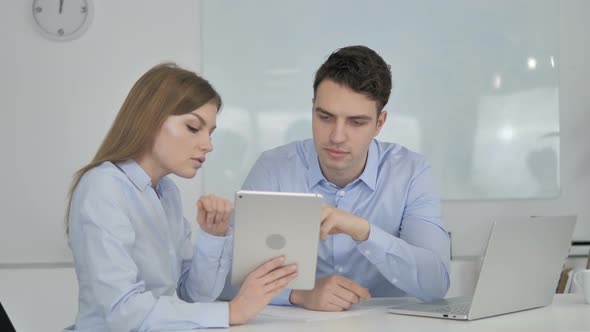 Business Colleagues Using Tablet in Office, Business Plan