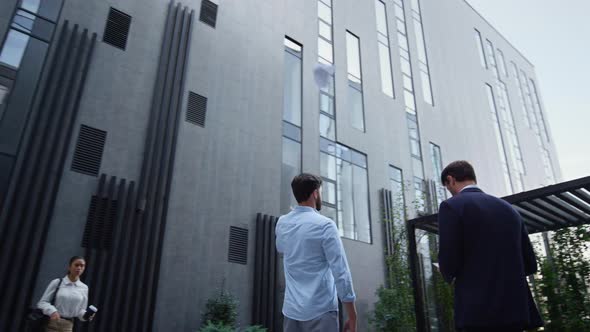 Angry Manager Throwing Papers at Downtown Office Building