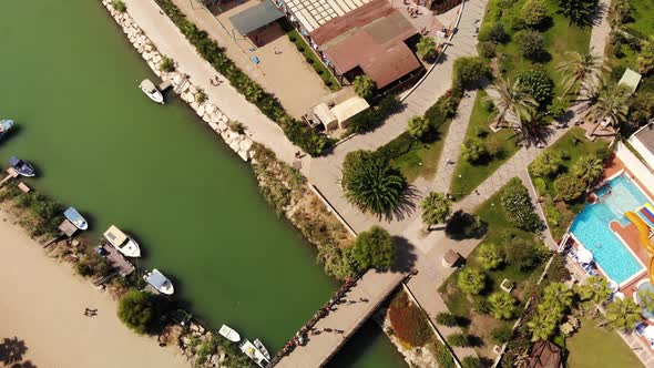 Flying over River Bridge and Holiday Area