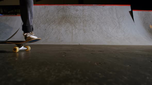 Man practicing skateboarding in skateboard arena 4k