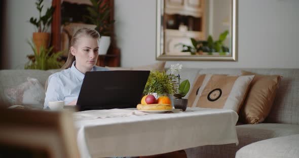 Home Office Concept - Woman Typing on Laptop Keyboard.