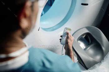 Unrecognizable Radiologist Setting MRI Scanner