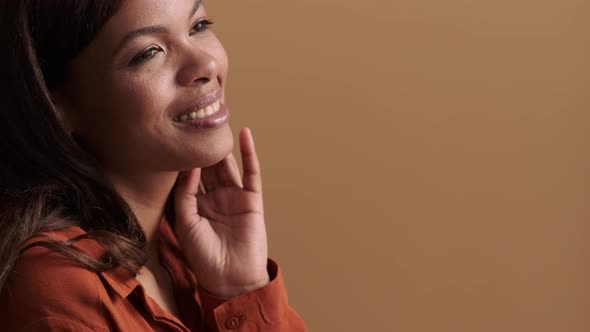 A close-up view of a happy african american woman posing