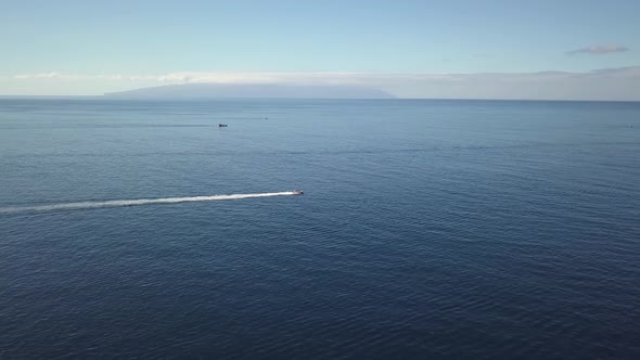 Chasing a boat near Acantilados de los Gigantes. In the background is the island La Gomera.