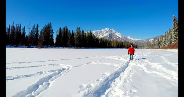 Man walking on snowy landscape