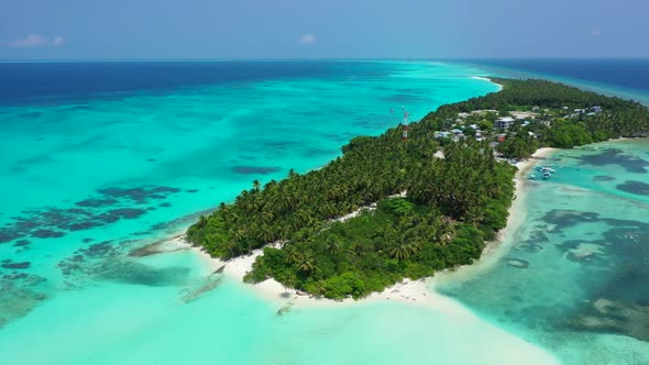 Aerial above scenery of luxury island beach voyage by blue sea and white sand background of a daytri