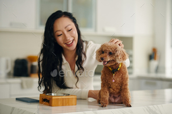 Woman Feeding Dog