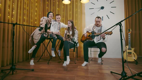 Family Coziness in Song and Music in the Evening at Home