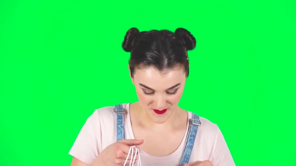 Girl Takes Out Small Box From the Packages and Is Very Happy on Green Screen, Slow Motion