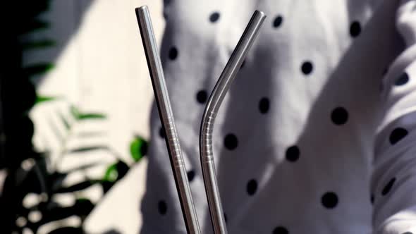 Slow Motion Woman Holding Reusable Metal Straw