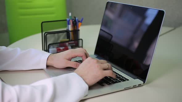 Doctor Working At His Laptop