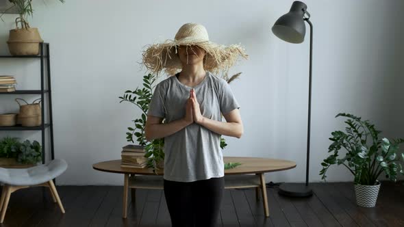 A Young Woman Rests And Relaxes in The Namaste Pose, Thinks about Good Thoughts