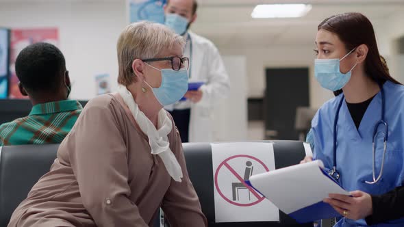 Medical Assistant and Elderly Patient Doing Checkup Consultation