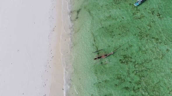 Boats Anchored Off the Coast on Shallow Ocean at Low Tide Aerial Top Zanzibar