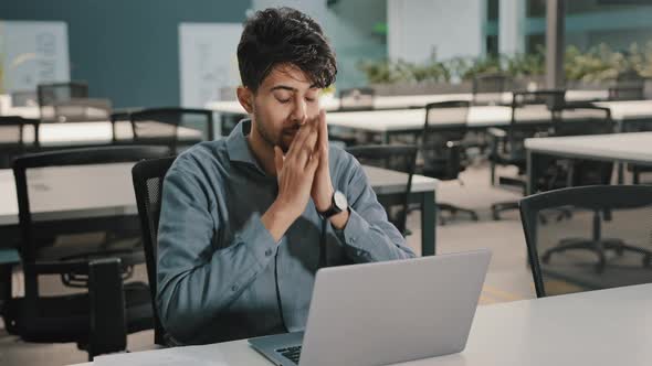 Exhausted Stressed Arabian Young Business Man Employee Guy Distracted From Laptop Take Break Close