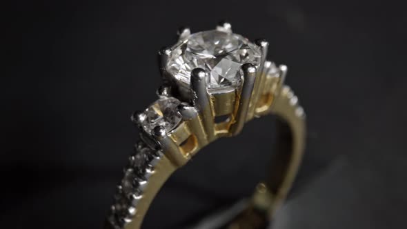 Extreme Detailed of Diamond Ring Close Up Shot While Rotating on Dark Background