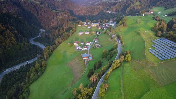 Aerial View of Solar Panels on Green Hills