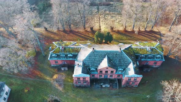 Old Red Brick House, Katvari Manor in Latvia and Katvaru Lake in the Background. Aerial Dron Shot 4K