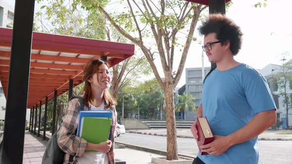Education and student concept. Two Students talking in university
