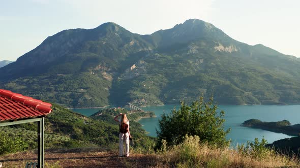 Woman Looking at Breathtaking View of Lake