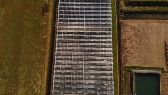 Aerial View Of Industrial Agricultural Greenhouses In Barendrecht. Birds Eye View Pedestal Down Doll