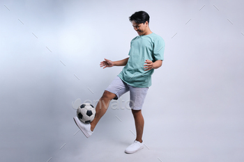 Football Player Juggling a Soccer Ball