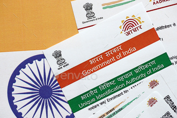 Indian Aadhaar card from Unique Identification Authority of India on Indian flag