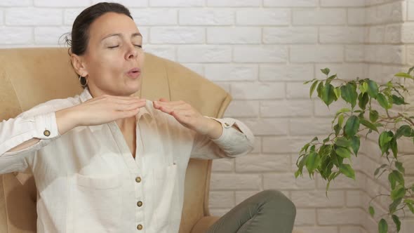 Relaxing Pose in Armchair on Workplace