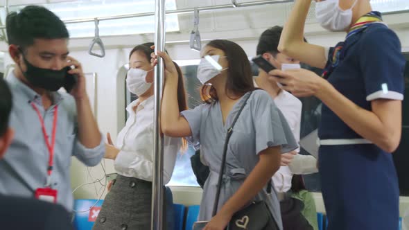 Crowd of People Wearing Face Mask on a Crowded Public Subway Train Travel