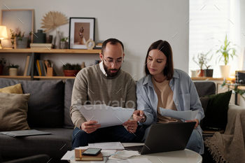 Couple discussing financial bills