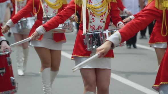 Young Girls Drummer in Red Vintage Uniform at the Parade