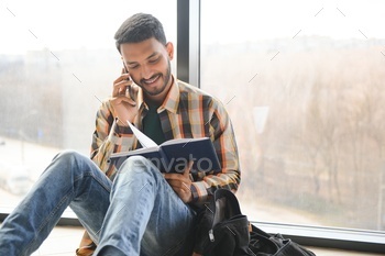 indian student with books at university