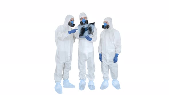 Team of Doctors in Protective Suits Looking at Lungs X-ray on White Background.