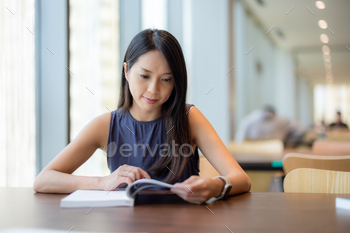 Woman read the book in library