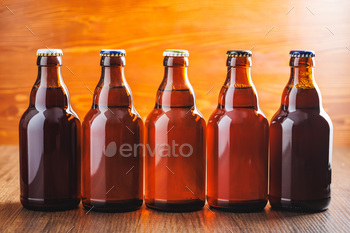 Bottles of beer on wooden table.