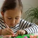 Ethnic Girl Playing with Modelling Clay - VideoHive Item for Sale