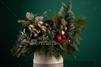 Basket Filled With Christmas Decorations on Table