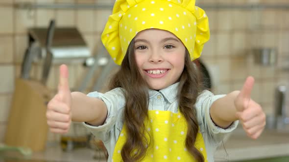 Cheerful Girl in Chef Uniform.