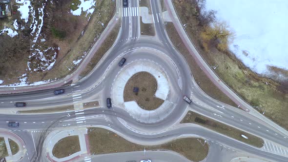 Hoovering Above Roundabout While Motor Vehicles Enters and Exits It