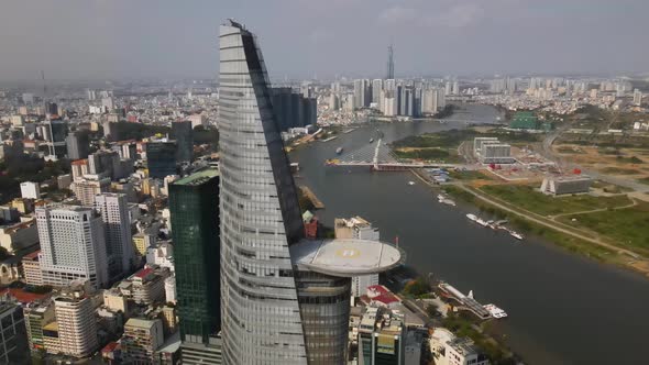 Aerial View of Bitexco Financial Tower With Heliport Above Song Sai Gon River in Ho Chi Minh City on