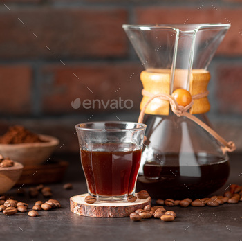 Coffee pitcher and a glass of coffee